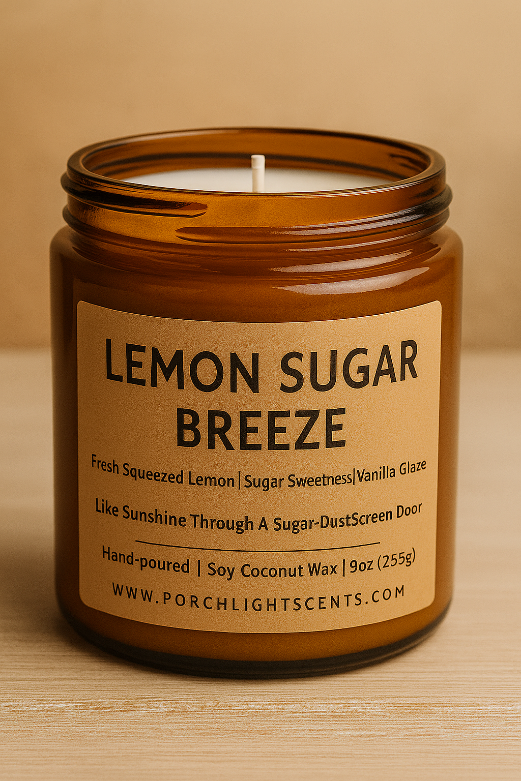 Candle in an amber jar labeled 'Lemon Sugar Breeze' on a beige background